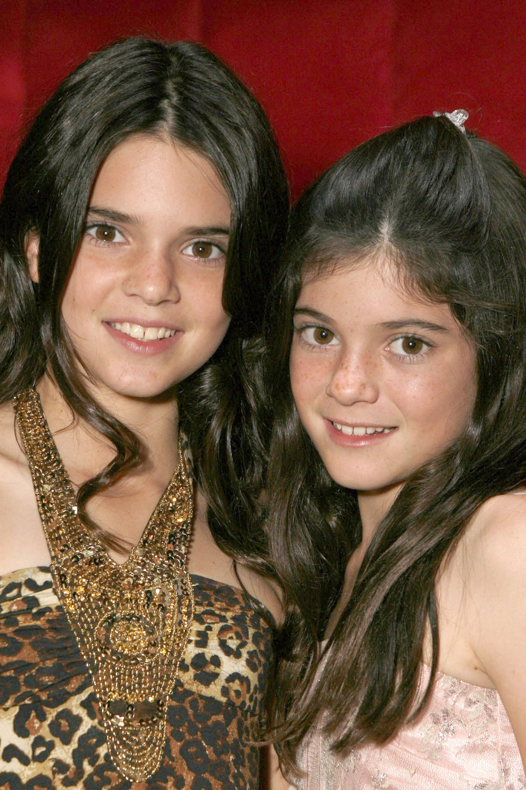 AGOURA HILLS, CA - OCTOBER 16: Kendall Jenner and Kylie Jenner pose for a photo at the "Keeping Up With the Kardashians" viewing party at Chapter 8 Restaurant on October 16, 2007 in Agoura Hills, California. (Photo by Jeff Vespa/WireImage) *** Local Caption ***