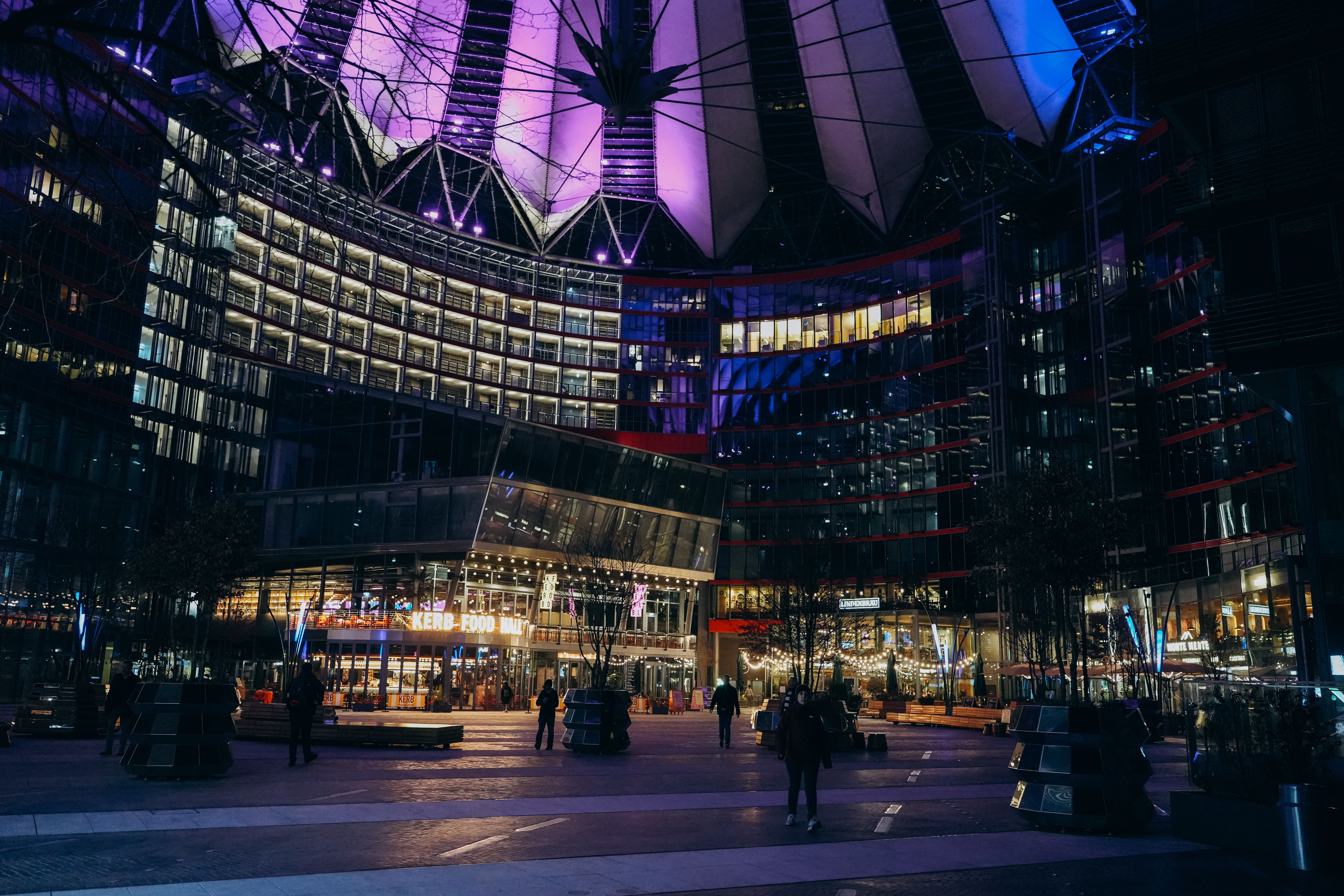Berlin's illuminated Sony Center at night, representing nightlife and the regulated adult-services environment.